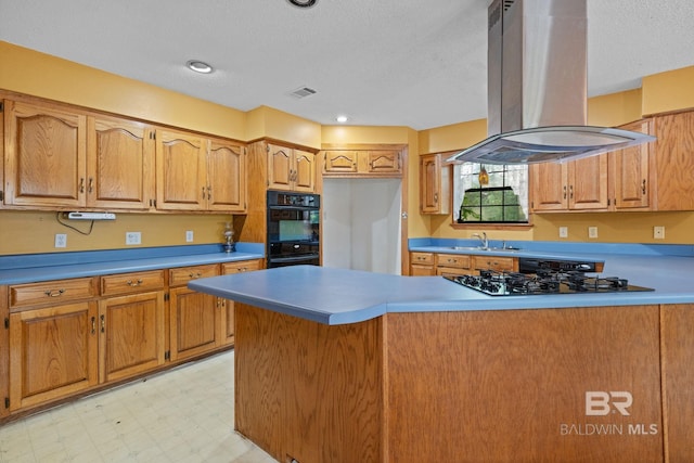 1510 Ponce De Leon Dr, Mobile, AL 36605 - kitchen featuring island range hood, a sink, black appliances, light floors, and a textured ceiling