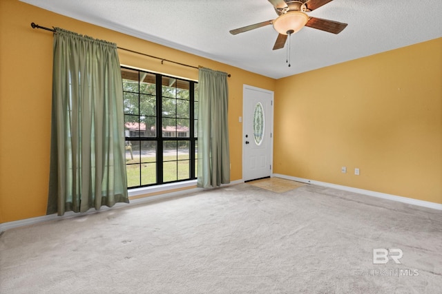 1510 Ponce De Leon Dr, Mobile, AL 36605 - empty room featuring carpet floors, a ceiling fan, baseboards, and a textured ceiling