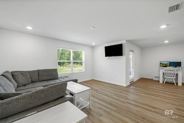 1149 Hayward Loop, Foley, AL 36535 - living area with light wood-type flooring, baseboards, recessed lighting, and a baseboard heating unit