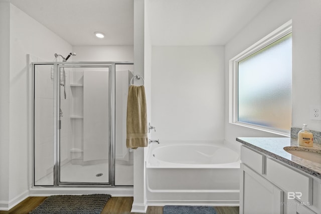 1149 Hayward Loop, Foley, AL 36535 - bathroom with a shower stall, wood finished floors, and a garden tub