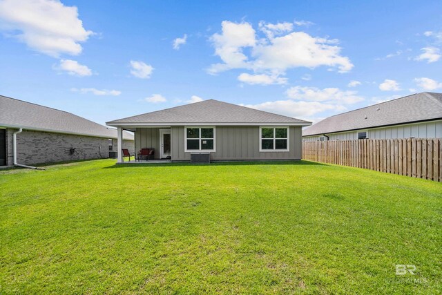 1149 Hayward Loop, Foley, AL 36535 - rear view of property featuring board and batten siding, a patio, and a shingled roof