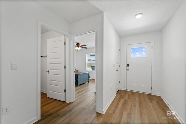 1149 Hayward Loop, Foley, AL 36535 - entryway with light wood-type flooring, baseboards, and ceiling fan