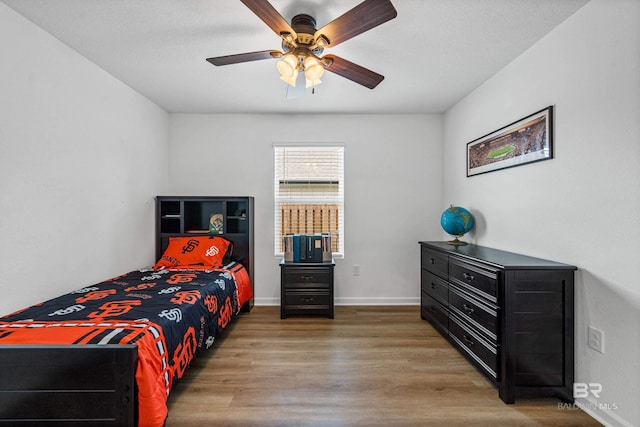 1149 Hayward Loop, Foley, AL 36535 - bedroom with wood finished floors, ceiling fan, and baseboards