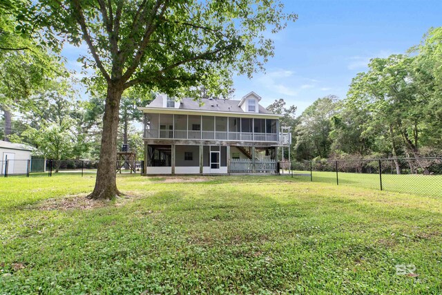 5039 W Cole Dr, Mobile, AL 36619 - back of property featuring a sunroom, a fenced backyard, and a yard