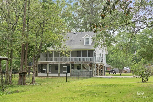 5039 W Cole Dr, Mobile, AL 36619 - back of house featuring a sunroom, a yard, and fence private yard
