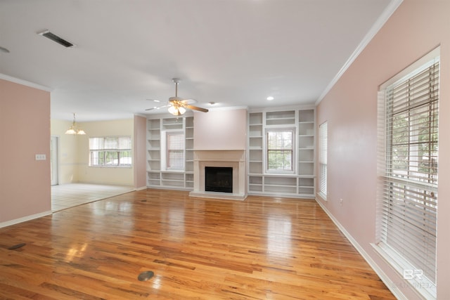 5039 W Cole Dr, Mobile, AL 36619 - unfurnished living room with crown molding, baseboards, light wood finished floors, and visible vents