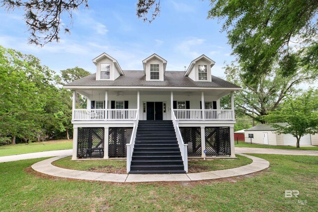 5039 W Cole Dr, Mobile, AL 36619 - view of front of house with roof with shingles, stairs, covered porch, a front yard, and an outdoor structure