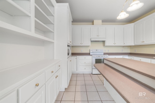 5039 W Cole Dr, Mobile, AL 36619 - kitchen featuring light tile patterned flooring, white appliances, under cabinet range hood, white cabinets, and hanging light fixtures