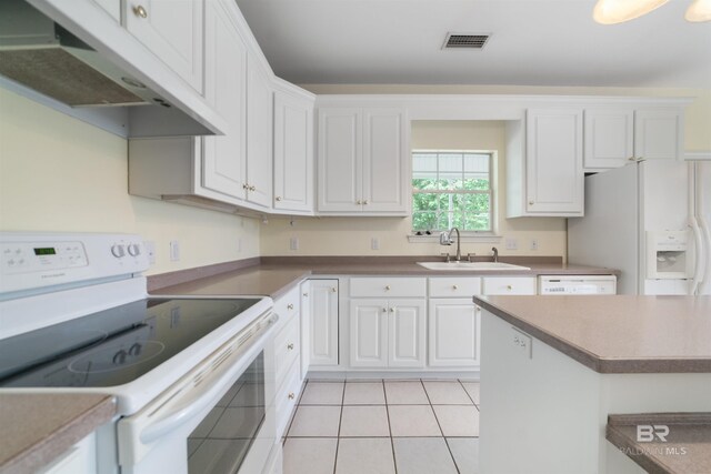 5039 W Cole Dr, Mobile, AL 36619 - kitchen featuring visible vents, a sink, under cabinet range hood, white appliances, and white cabinetry