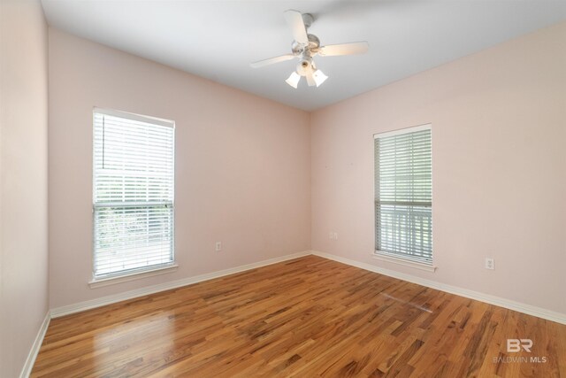 5039 W Cole Dr, Mobile, AL 36619 - unfurnished room with baseboards, ceiling fan, and wood finished floors