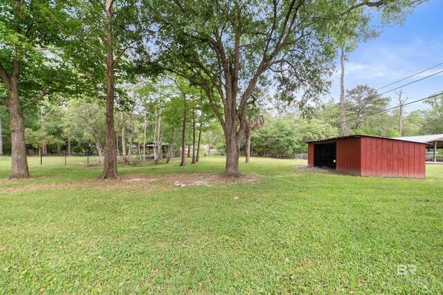 5039 W Cole Dr, Mobile, AL 36619 - view of yard with fence, a pole building, and an outbuilding
