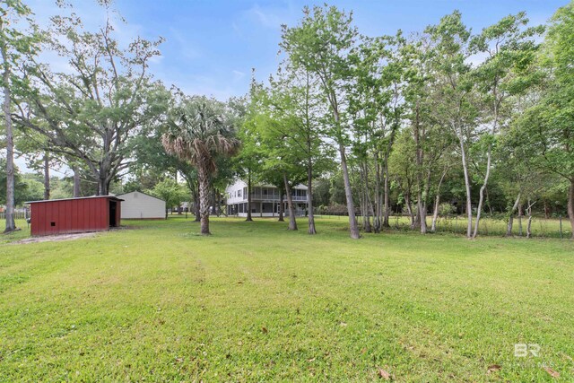 5039 W Cole Dr, Mobile, AL 36619 - view of yard featuring an outdoor structure and an outbuilding