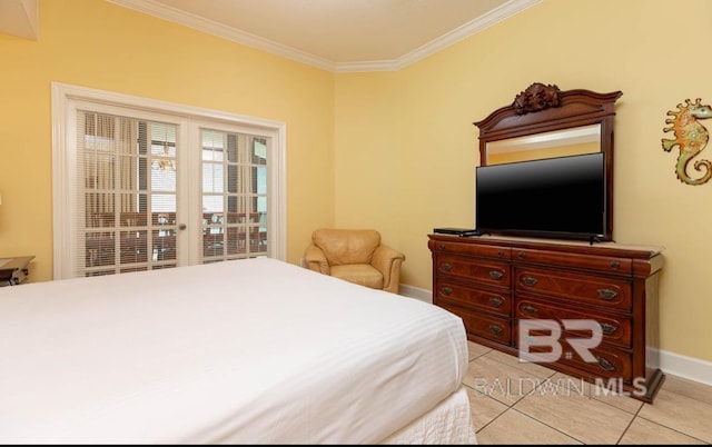 bedroom featuring light tile patterned flooring, crown molding, and baseboards