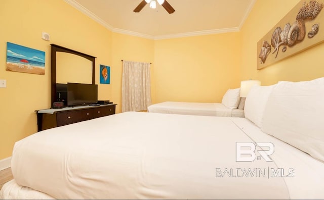 bedroom featuring crown molding and ceiling fan