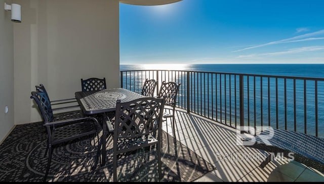 balcony featuring a water view
