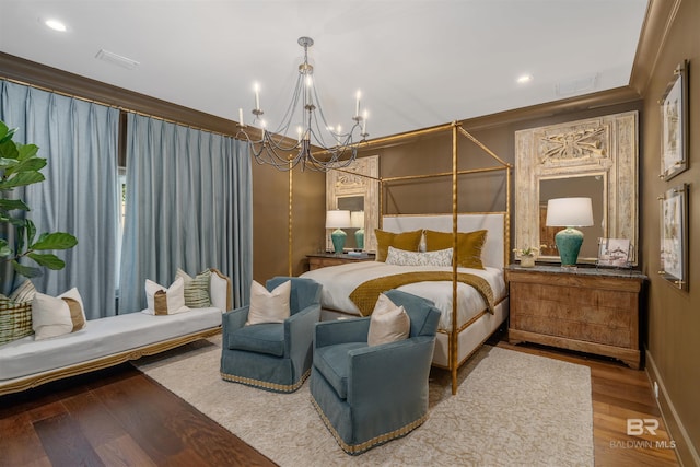 bedroom featuring a notable chandelier, hardwood / wood-style flooring, and crown molding