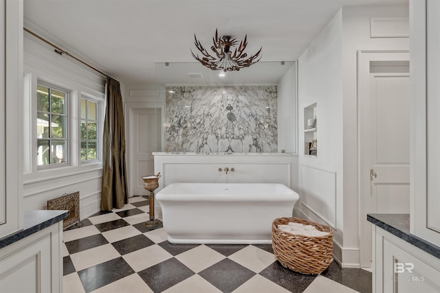 bathroom with a bathing tub and vanity