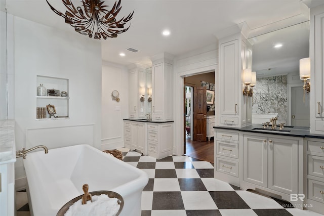 bathroom featuring vanity, a bathtub, and wood-type flooring