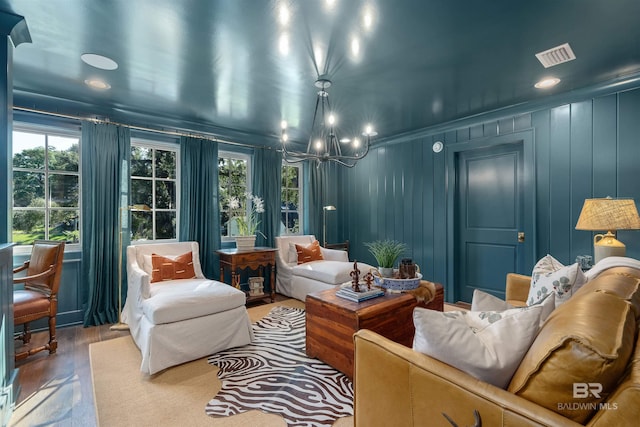 interior space with hardwood / wood-style flooring and a chandelier