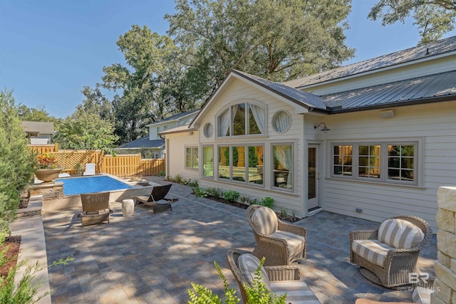 exterior space featuring an outdoor fire pit