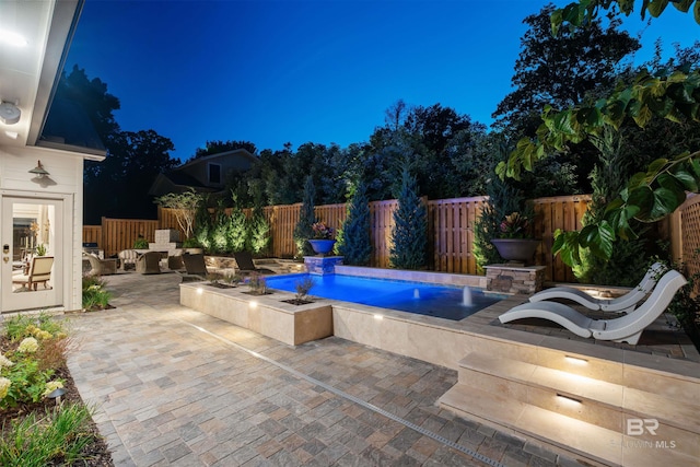 view of pool featuring a patio area and pool water feature