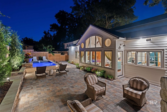 view of patio at twilight