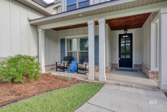 12708 Ibis Blvd, Spanish Fort, AL 36527 - doorway to property featuring covered porch and board and batten siding