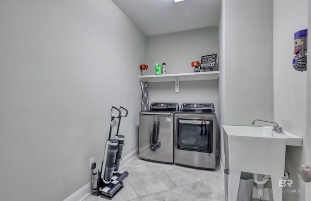 12708 Ibis Blvd, Spanish Fort, AL 36527 - washroom featuring washing machine and clothes dryer and baseboards