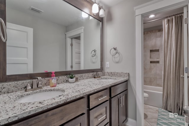 12708 Ibis Blvd, Spanish Fort, AL 36527 - full bath featuring double vanity, tile patterned flooring, shower / bath combination with curtain, and toilet