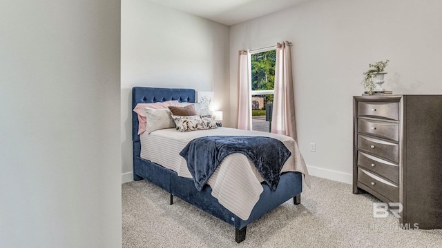 bedroom with light colored carpet