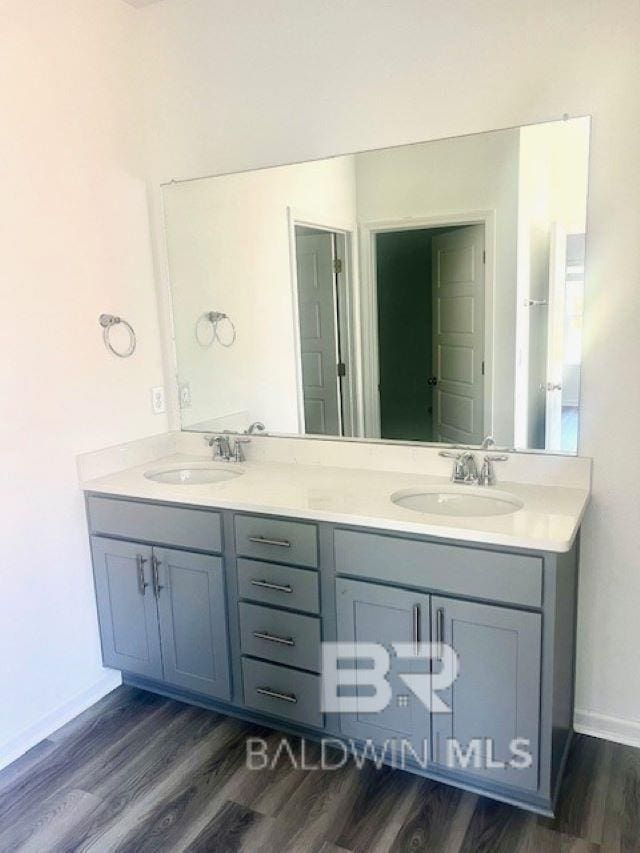 bathroom featuring vanity and hardwood / wood-style floors