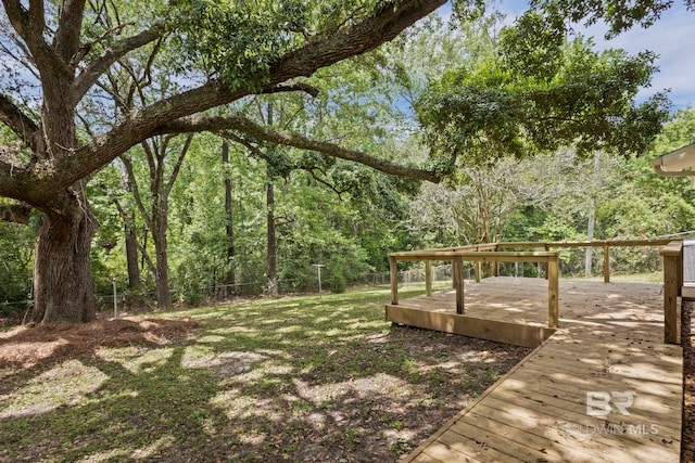 view of yard with fence and a wooden deck