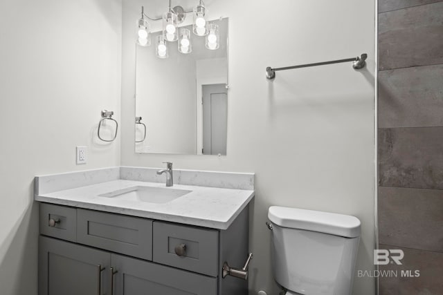 full bath featuring toilet and vanity