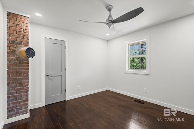 unfurnished room with a ceiling fan, baseboards, recessed lighting, visible vents, and dark wood-style floors