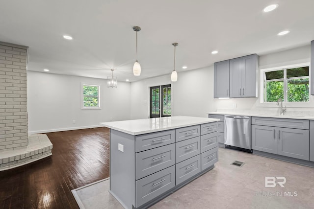 kitchen with stainless steel dishwasher, recessed lighting, and gray cabinets