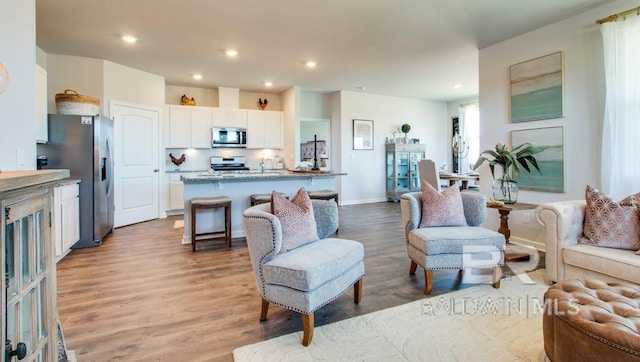 138 Preston Way, Gulf Shores, AL 36542 - living room featuring light wood-style flooring, recessed lighting, and baseboards