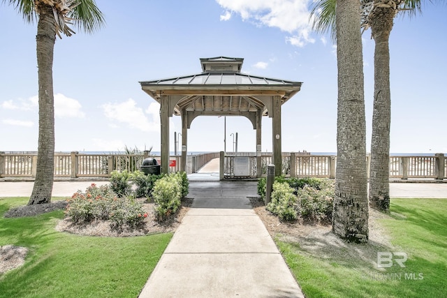 surrounding community with a lawn and a gazebo