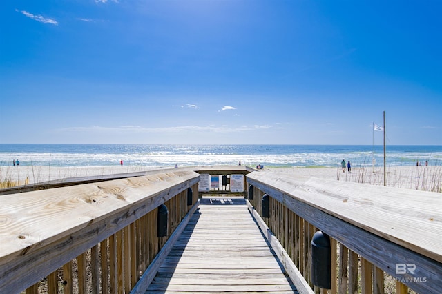 view of property's community with a view of the beach and a water view