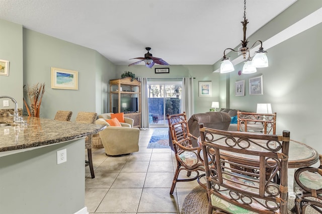 dining room with light tile patterned floors and ceiling fan