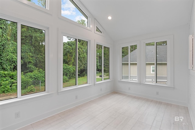 unfurnished sunroom with lofted ceiling