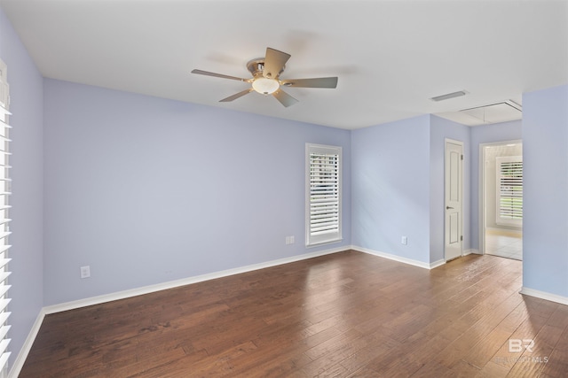 unfurnished room with dark wood-type flooring and ceiling fan