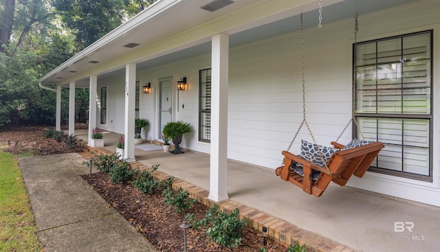 entrance to property with covered porch