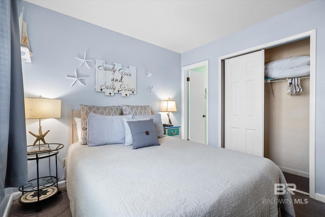 carpeted bedroom with a closet