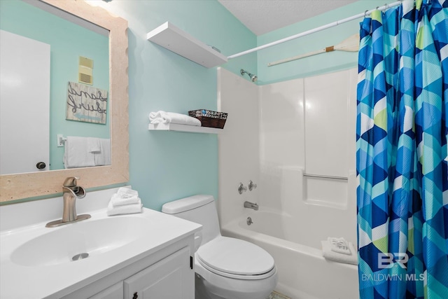 full bathroom featuring toilet, a textured ceiling, vanity, and shower / tub combo