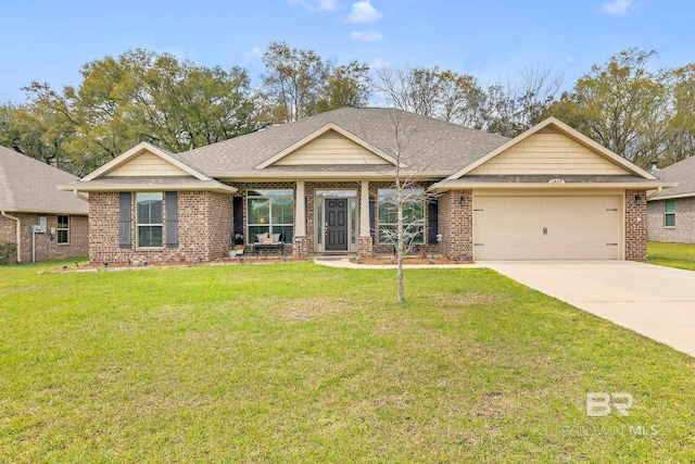 craftsman-style home with an attached garage, concrete driveway, brick siding, and a front yard