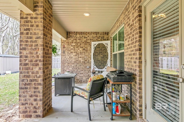 view of patio featuring fence