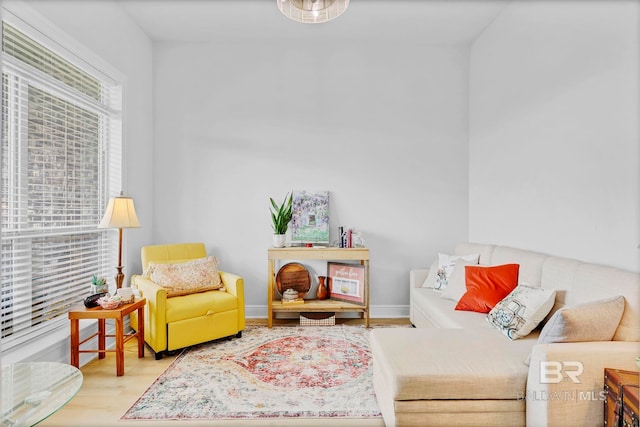 living room featuring baseboards and wood finished floors