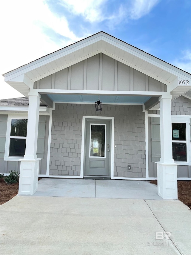 doorway to property featuring covered porch