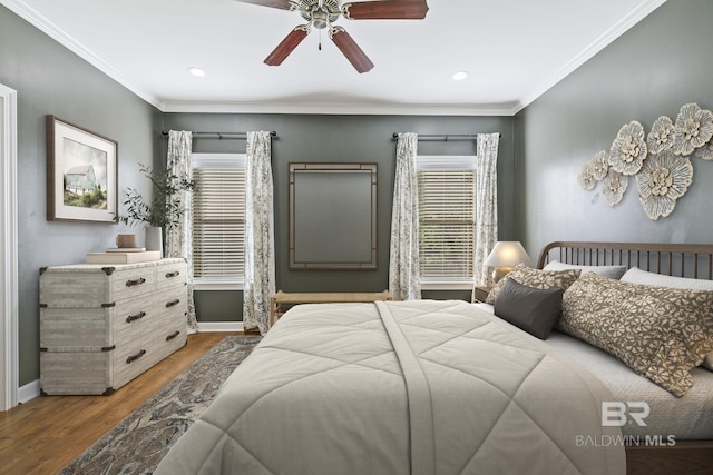 bedroom featuring ceiling fan, ornamental molding, and hardwood / wood-style flooring