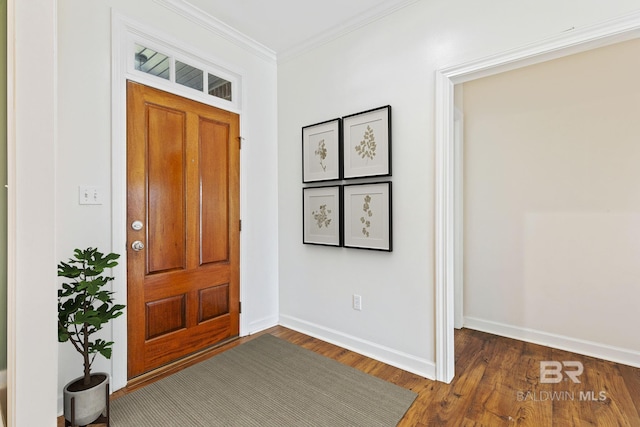 entryway with ornamental molding, dark wood-style flooring, and baseboards